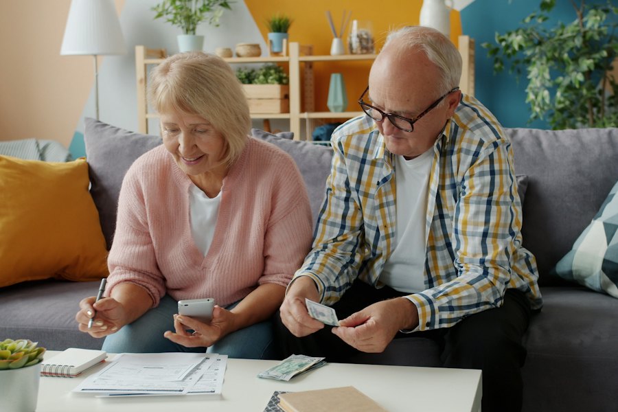 An older couple reviewing paperwork together at home
